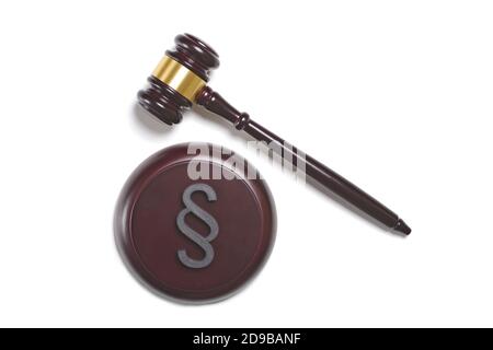 Wooden gavel and sound block with paragraph / section sign isolated on white background. High angle view with copy space. Stock Photo