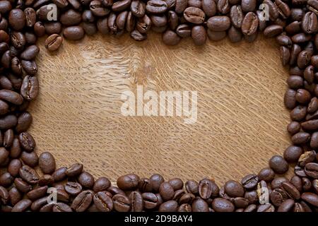 coffee beans border on wooden background Stock Photo