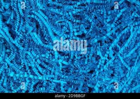 blue background. volumetric texture. Paper filler. Filler for gifts. for a paper party. For gift wrapping Stock Photo