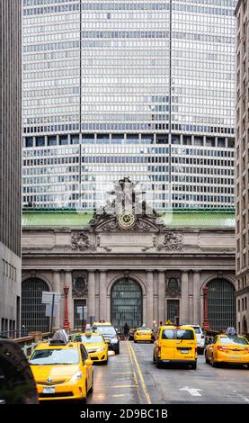NEW YORK, USA - May 04, 2016: Grand Central Terminal in New York City. Clock and statue on grand central station in NYC with office building in the ba Stock Photo