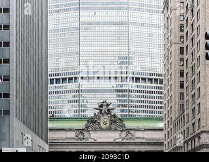 NEW YORK, USA - May 04, 2016: Grand Central Terminal in NYC. Clock and statue on grand central station in new york city with office building in the ba Stock Photo