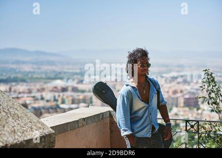 Portrait of young attractive man with dark skin. He is a musician from Latin America. Stock Photo