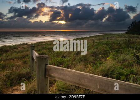 Sunrise while a storm is brewing on the horizon Stock Photo