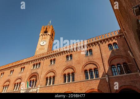 Clock tower or Torre Civica in Italian in Treviso in Italy in a sunny day Stock Photo