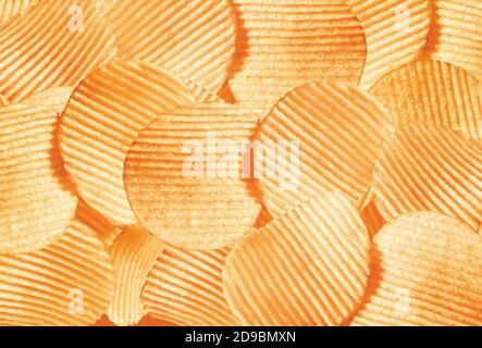 Namkeen - Potato Chips Wafers, corrugated golden chips with texture, Fluted chips with potatoes, tasty ridged potato chips, background image. Stock Photo