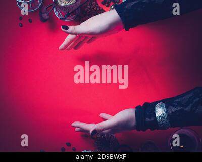 a fortune teller holds a dried Rowan tree for divination. blank for the designer.  The concept of magic and occultism. Divination. Top view, tinted. Stock Photo