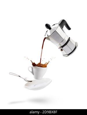 pouring coffee into cup from coffeepot with splashing Stock Photo