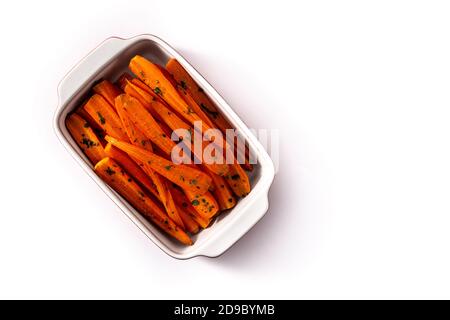 Honey glazed carrots isolated on white background Stock Photo