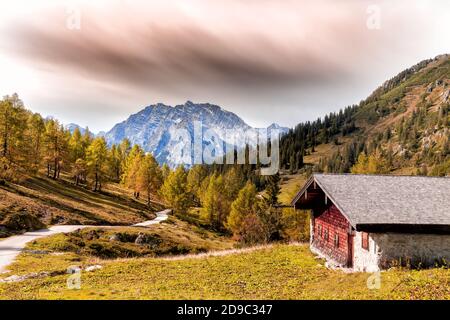 Alpine cabin in front of Watzmann in Berchtesgadener Land, Bavaria, Germany, in autumn. Stock Photo