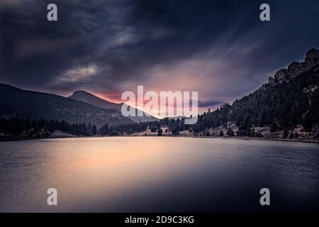 Dramatic sunrise due to smoke from the wildfires over the Lily Lake, Estes Park, Colorado Stock Photo