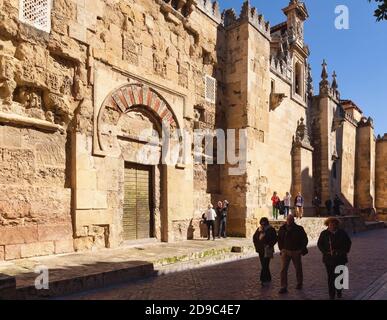 The Mosque-Cathedral of Cordoba, Cordoba Province, Andalusia, southern Spain.  A Unesco World Heritage Site.  People walking by the Puerta de San Este Stock Photo