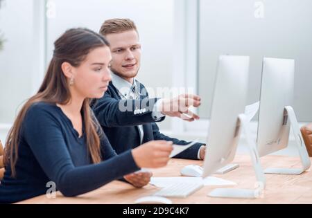 close up. young employees discussing online information Stock Photo
