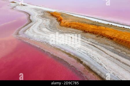 Aerial view of pink salt lakes, sandy and salt shores along the cape. Stock Photo