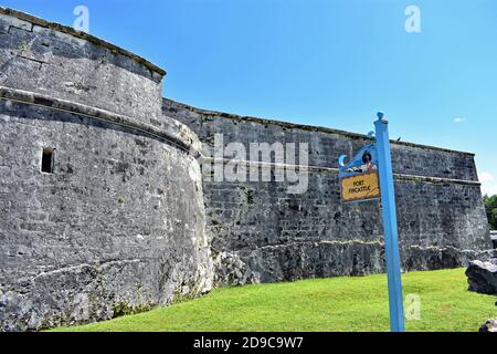 Fort Fincastle located on Bennet's Hill in the city of Nassau on the island of New Providence in the Bahamas. A blue and yellow sign post is visible. Stock Photo