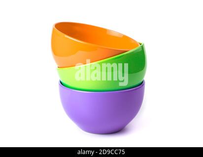 Deep bowls of bright colors on a white background. Stock Photo