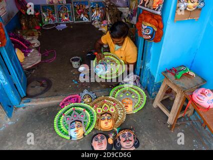 Charida, Purulia, West Bengal / India - November 01,2020. An Unidentified Rural Artisan completing Chhau Masks at his workshop. Stock Photo