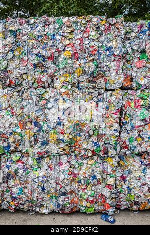 Stacked cubes or bales of aluminum cans crushed into blocks for recycling. Stock Photo