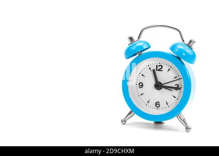 Classic retro blue alarm clock on isolated white background Stock Photo