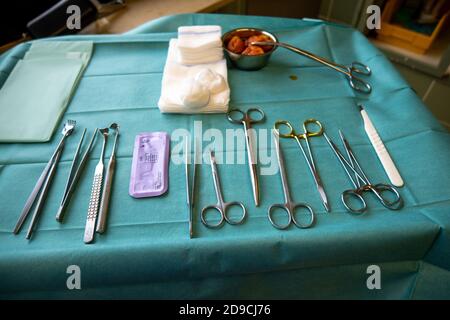 surgical instruments on a small instrument table for performing an operation Stock Photo