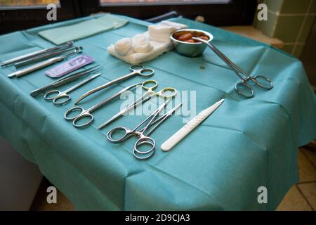 surgical instruments on a small instrument table for performing an operation Stock Photo