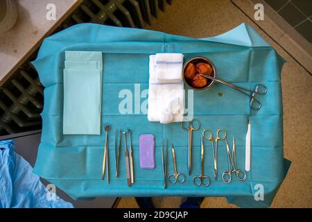 surgical instruments on a small instrument table for performing an operation Stock Photo