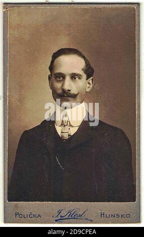 POLICKA - AUSTRIA - HUNGARY - CIRCA 1910: Vintage cabinet card shows portrait of the middle-aged man with moustache. Edwardian fashion. Photo was take Stock Photo