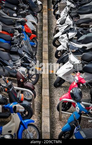 Looking down at a packed moped parking lot in Yokosuka, Japan. Stock Photo