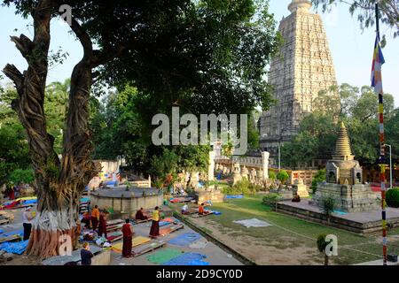 India Bodh Gaya - Mahabodhi Temple Complex area view with praying monks Stock Photo