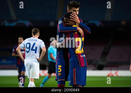 Barcelona, Spain. 4th Nov, 2020. Barcelona's Gerard Pique (L) celebrates the goal with teammate Ansu Fati during the UEFA Champions League Group G match between FC Barcelona and Dynamo Kyiv in Barcelona, Spain, on Nov. 4, 2020. Credit: Joan Gosa/Xinhua/Alamy Live News Stock Photo