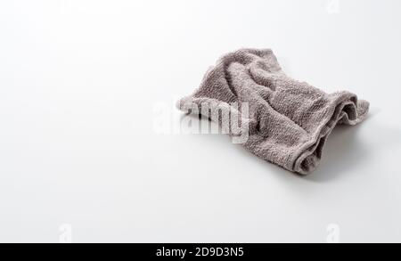 A grey rag placed on a white background with space Stock Photo