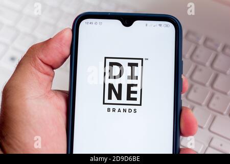 In this photo illustration the Dine Brands Global logo seen displayed ...