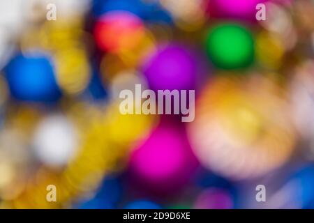 Out of focus creative Christmas holiday decorations, abstract blurry bokeh background effect. Defocus glowing lights celebration texture Stock Photo