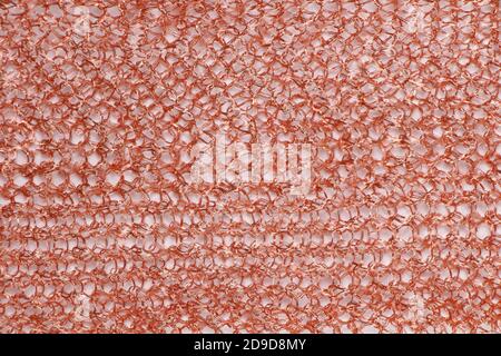 Image of knitted red metal grid on white background Stock Photo