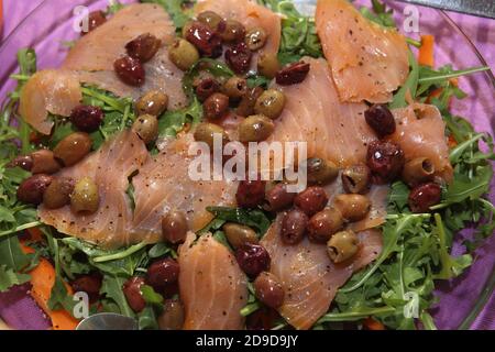 fish dishes: smoked salmon with olives Stock Photo