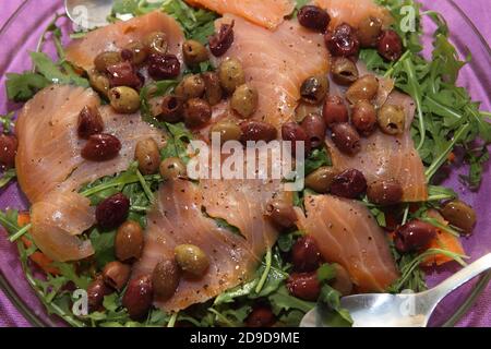 fish dishes: smoked salmon with olives Stock Photo