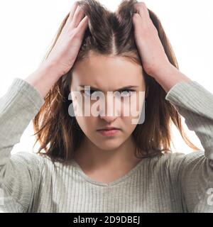 young angry brunet woman portrait isolated on white background Stock Photo