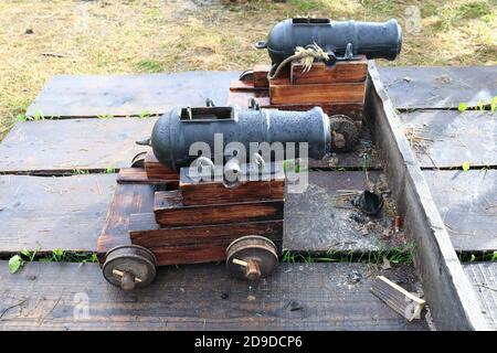 Details of two signal cannons on wooden wheels Stock Photo