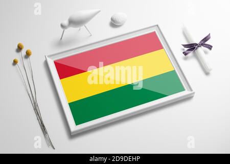 Bolivia flag in wooden frame on table. White natural soft concept, national celebration theme. Stock Photo