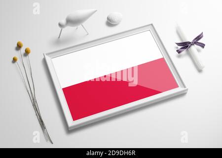 Poland flag in wooden frame on table. White natural soft concept, national celebration theme. Stock Photo