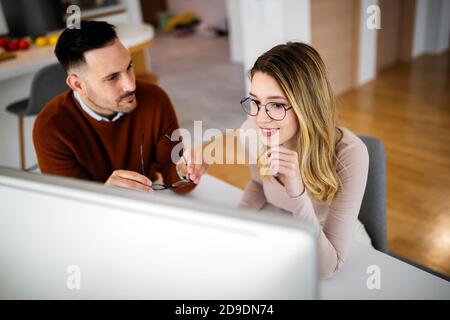 Business people having fun and chatting at workplace office Stock Photo