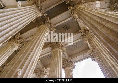 Vintage Old Justice Courthouse Column. Neoclassical colonnade with corinthian columns as part of a public building resembling a Greek or Roman temple Stock Photo