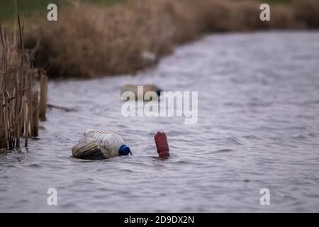 Plastic bottles floating on water on a lake Stock Photo