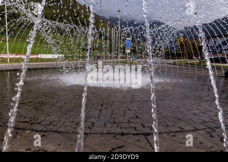 Frozen drops of falling water of a fountain on a roundabout Stock Photo