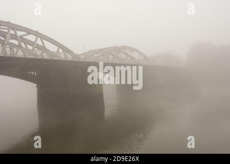 A fog covered Barnes Railway Bridge on the River Thames, Barnes, London, SW13, England U.K. Stock Photo