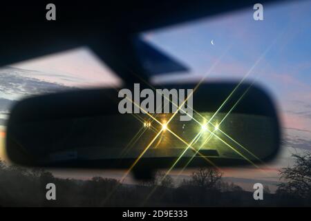 traffic at night reflected in vehicle rear view mirror york yorkshire united kingdom Stock Photo
