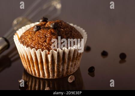selective focus on a homemade cup cake muffin on glossy reflecting surface Stock Photo