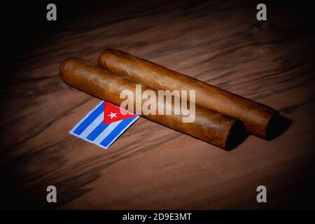 Luxury Cuban cigars and match bow on the wooden desk Stock Photo