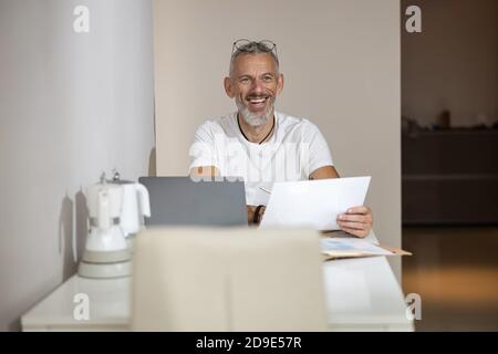 Man in a good mood happy with his work Stock Photo