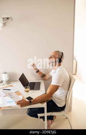 Male with a trading map picture having an idea Stock Photo
