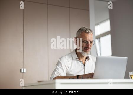Determined specialist pressing the buttons on a keyboard Stock Photo